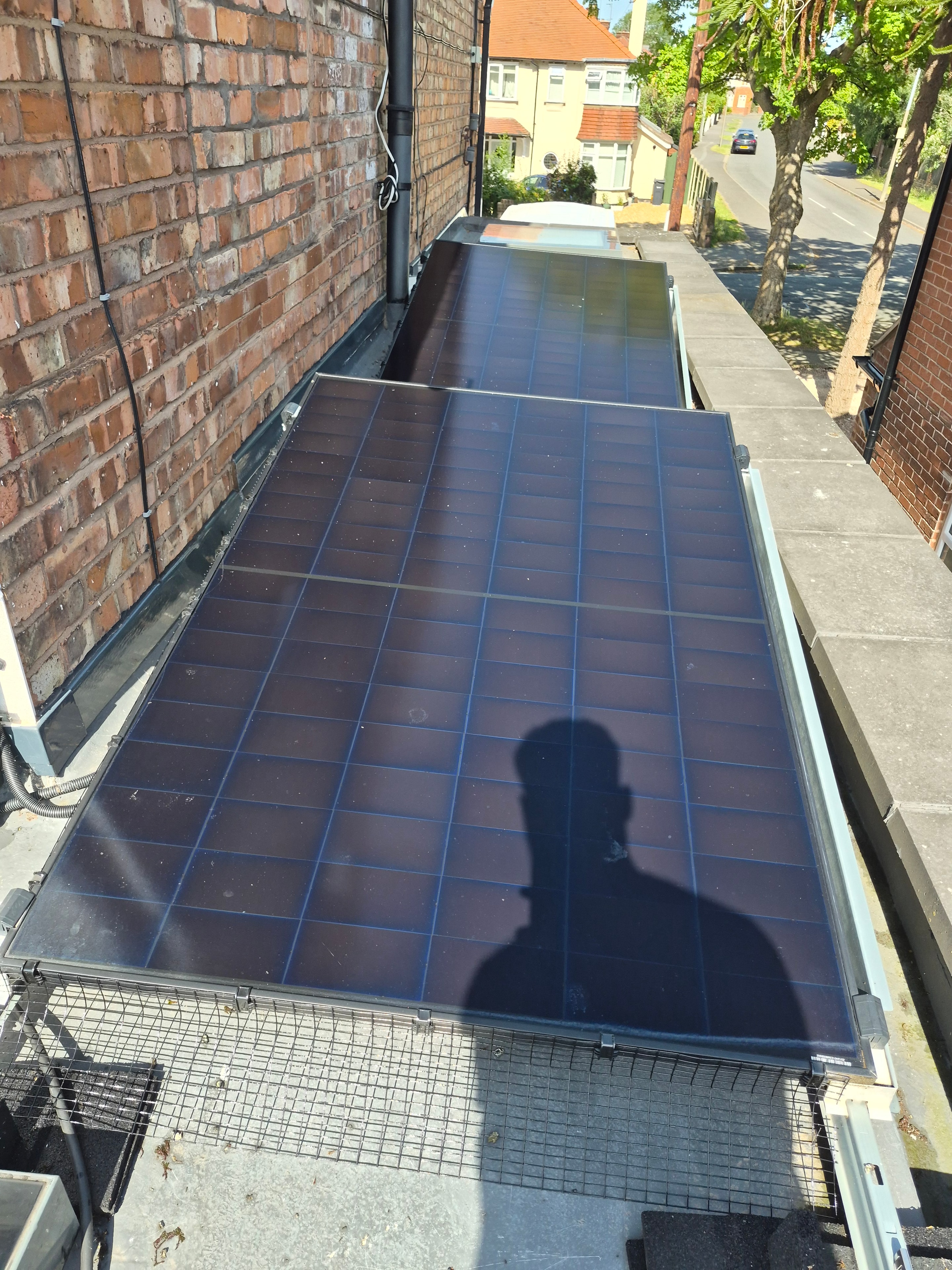 Clean solar panels gleaming on residential rooftop